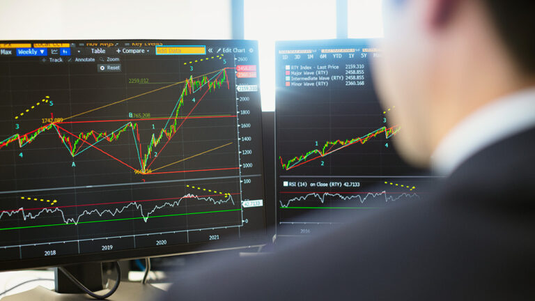 Investor looking at market charts